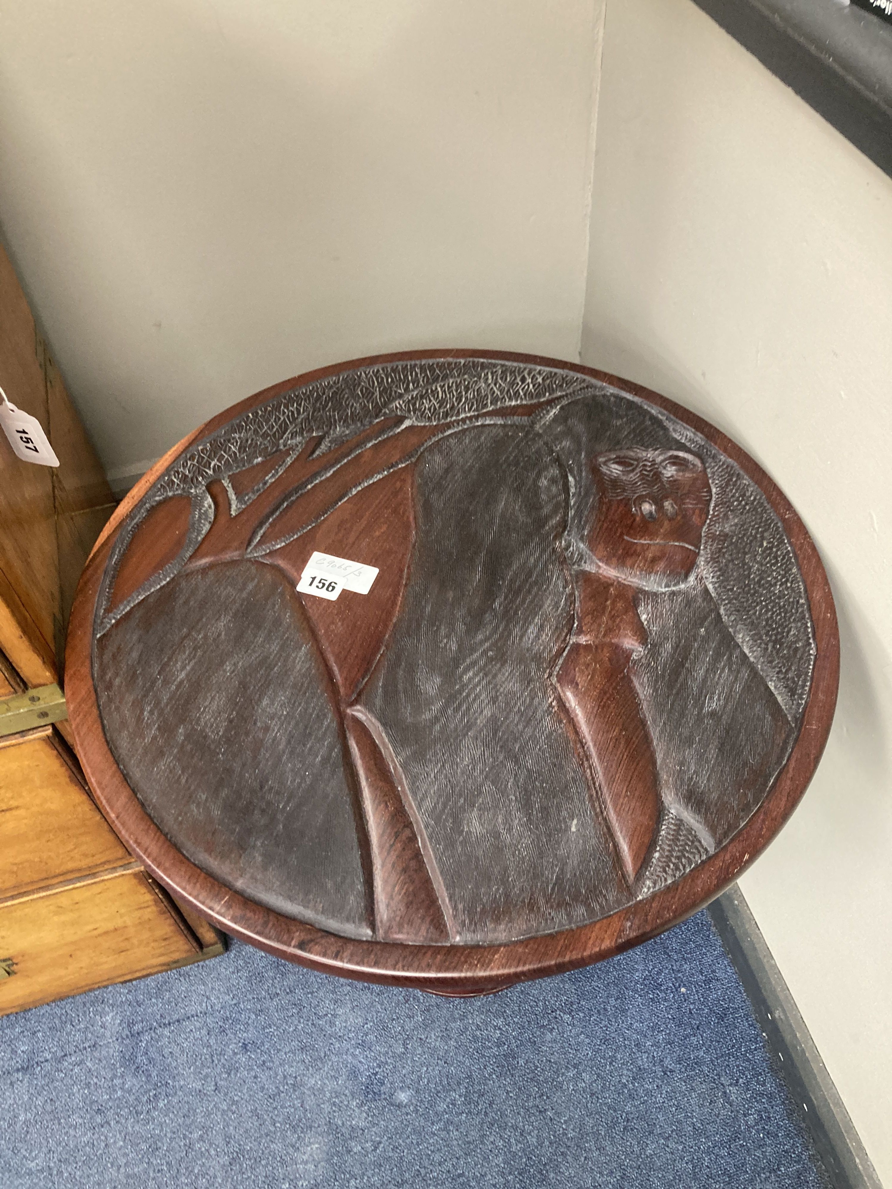 An African carved hardwood pedestal table, diameter 54cm, height 57cm